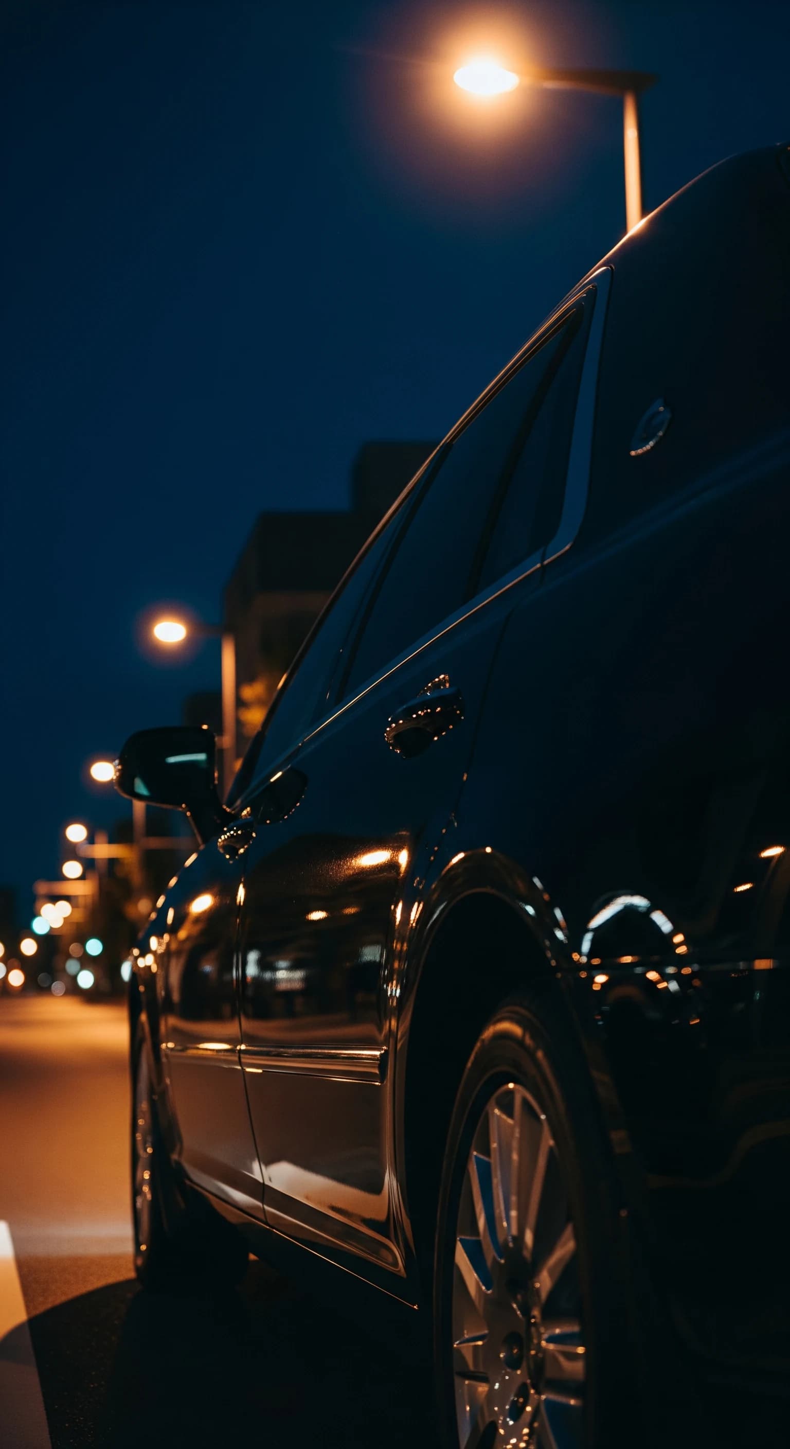 Premium chauffeur against the Osaka night skyline